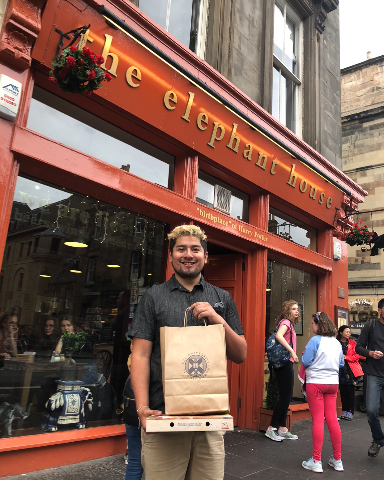 Gonzales stands in front of the famous Elephant House in Edinburgh. The bright orange cafe is credited as the birthplace of Harry Potter.