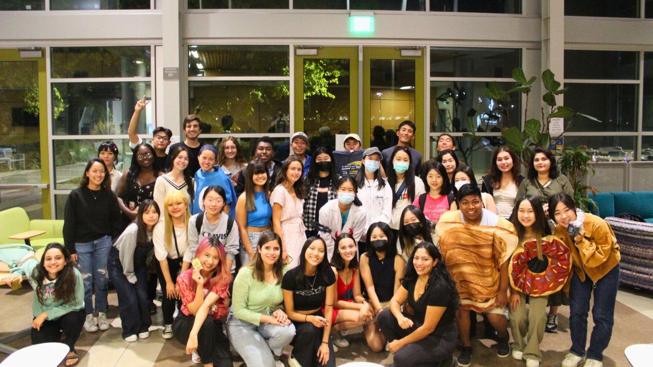 Photo of student in the lobby of the International Center at UC Davis smiling