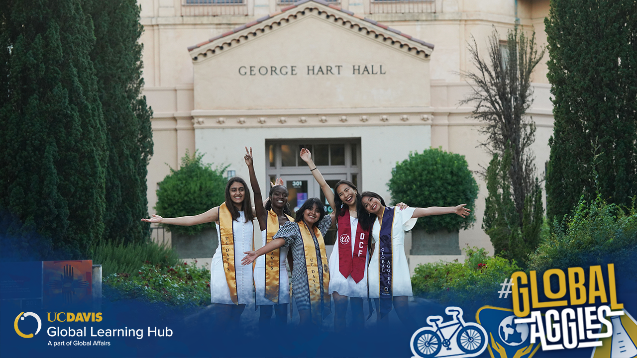 Group photo of students standing in front of the George Hart Hall building on the UC Davis campus.