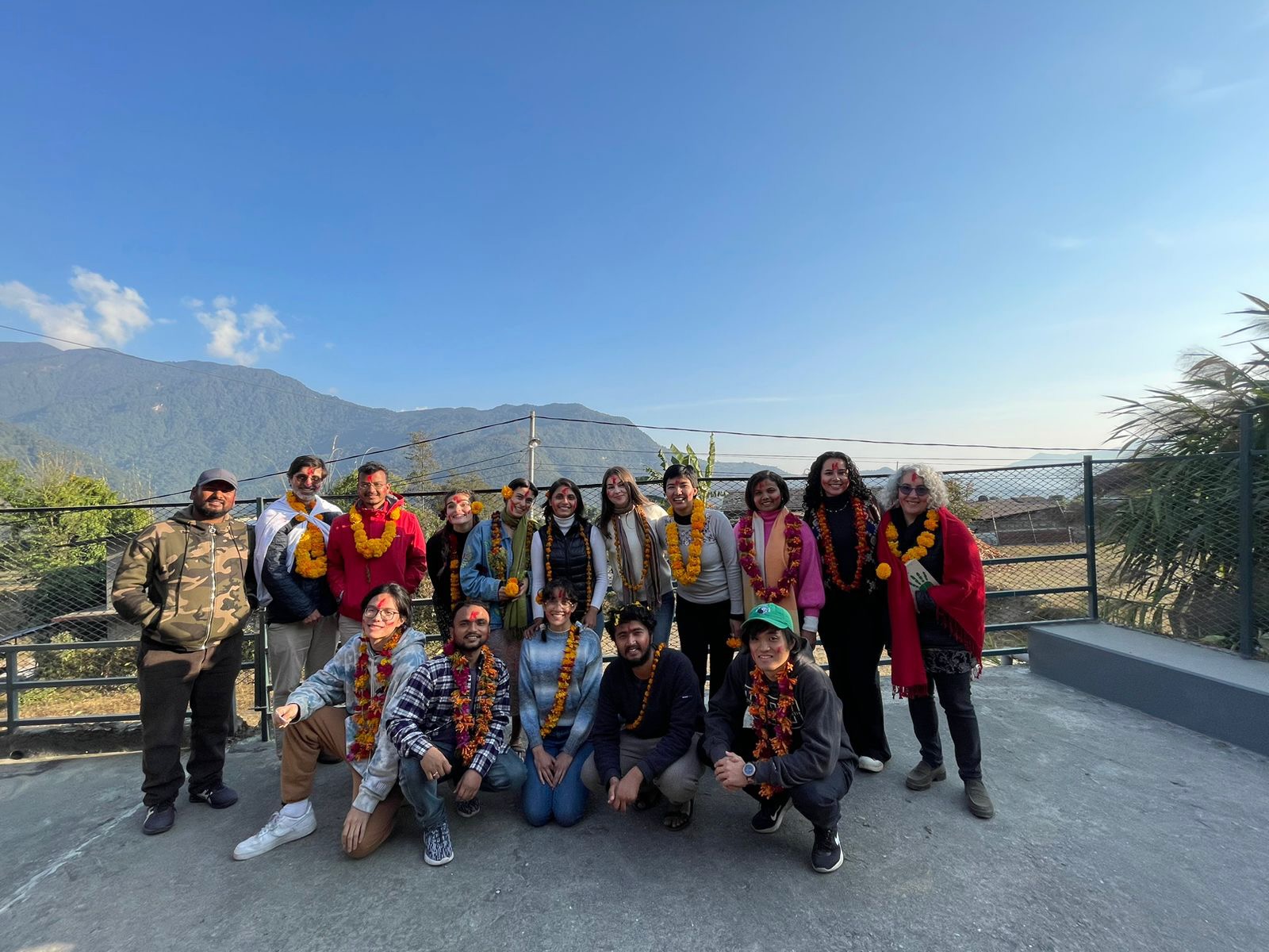 Hatano poses alongside his Agriculture Co-Op project team in Nepal.