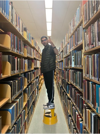 Kai, a senior, working at Shield's Library.