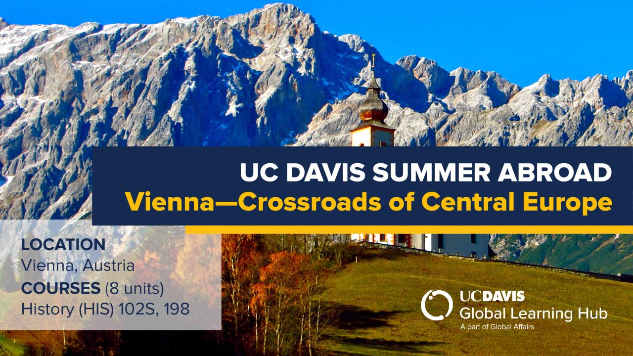 Promotional banner for the UC Davis Summer Abroad program titled 'Vienna—Crossroads of Central Europe.' In the foreground, a scenic alpine church with a traditional red-roofed bell tower stands on a grassy hillside, surrounded by autumn trees. In the background, a striking mountain range with rugged, rocky peaks rises against a bright blue sky. Text overlays include program details: 'Location: Vienna, Austria,' and 'Courses: (8 units) History (HIS) 102S, 198.' A logo is in the right bottom corner.